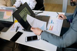 Melbourne small business owner reviewing EOFY financial charts on laptop